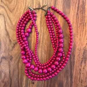 Pinkish red multi-strand beaded necklace
